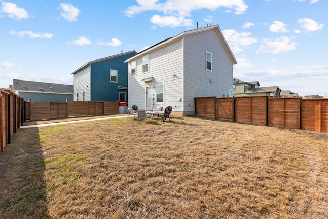 back of house with a yard