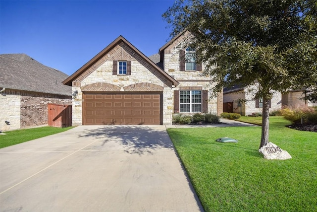 view of front facade featuring a garage and a front lawn