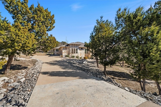 804 Laughing Dog Ct, Leander, TX 78641 - view of property hidden behind natural elements featuring stone siding