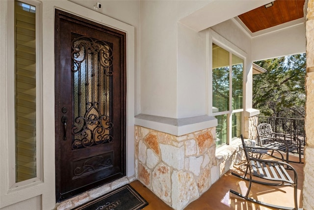 804 Laughing Dog Ct, Leander, TX 78641 - property entrance with stone siding and a porch