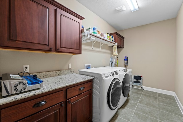 804 Laughing Dog Ct, Leander, TX 78641 - laundry room with washer and clothes dryer, cabinet space, baseboards, and light tile patterned floors