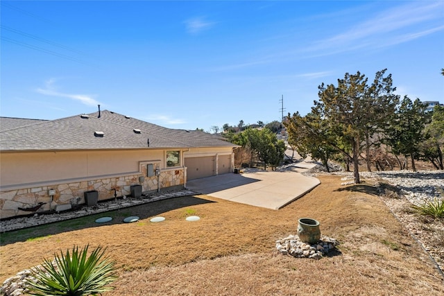804 Laughing Dog Ct, Leander, TX 78641 - view of yard with an attached garage and driveway