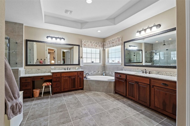 804 Laughing Dog Ct, Leander, TX 78641 - bathroom with a stall shower, two vanities, and a garden tub