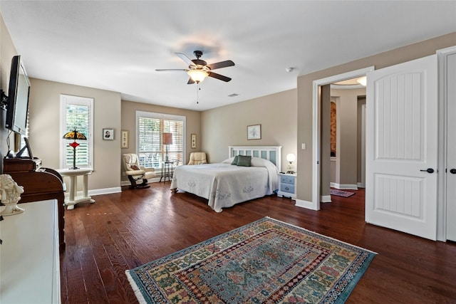 804 Laughing Dog Ct, Leander, TX 78641 - bedroom featuring wood finished floors, baseboards, and a ceiling fan