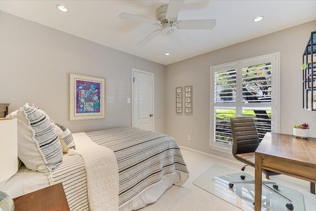 bedroom featuring light colored carpet and ceiling fan