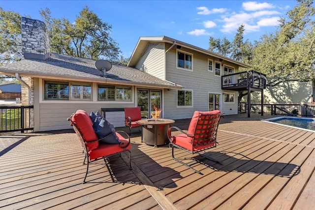 deck with an outdoor fire pit