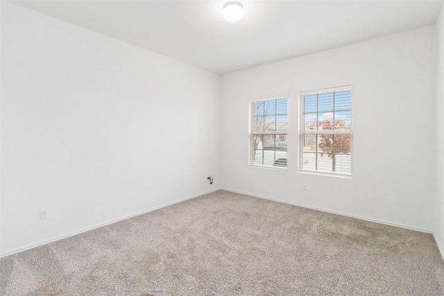 spare room featuring carpet flooring