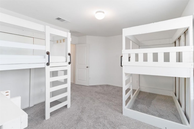 bedroom with light colored carpet