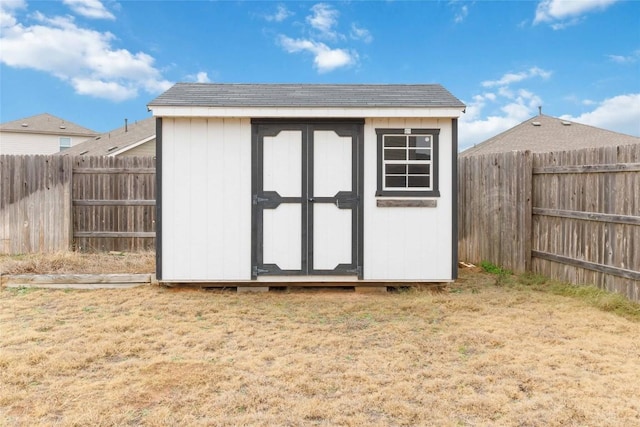 view of outbuilding with a lawn