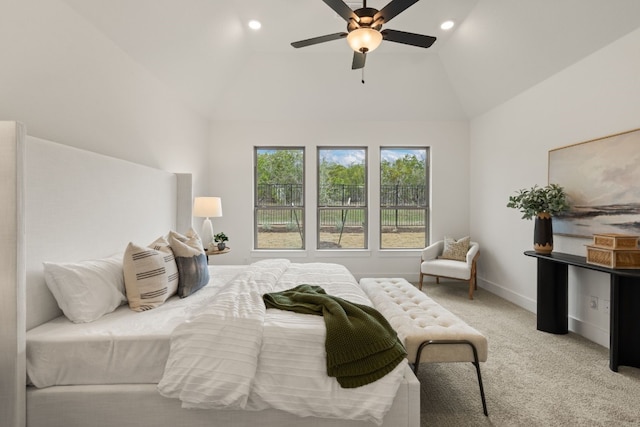 bedroom featuring ceiling fan, light colored carpet, and lofted ceiling