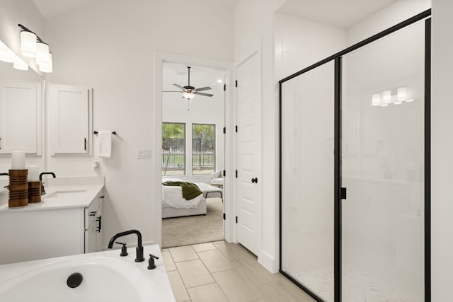 bathroom featuring vanity, shower with separate bathtub, and ceiling fan