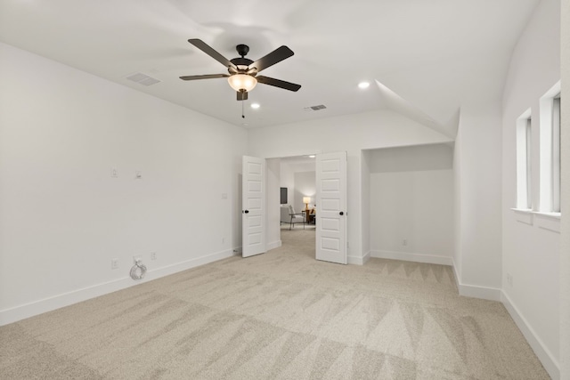 unfurnished bedroom featuring light carpet and ceiling fan