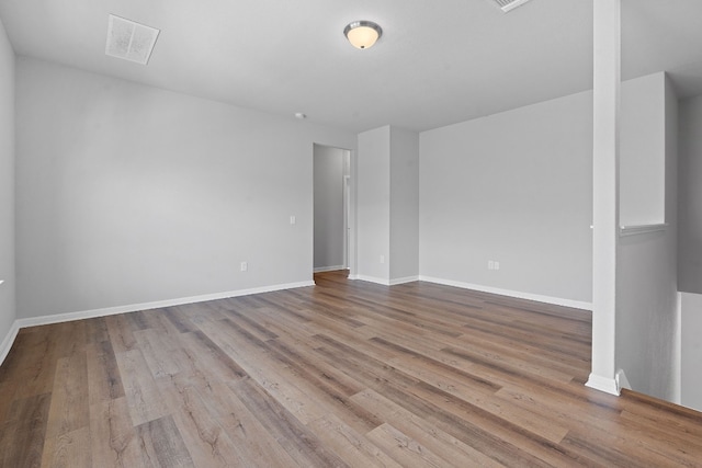 spare room with light wood-type flooring