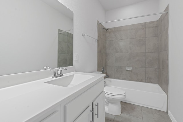 full bathroom featuring vanity, tile patterned flooring, tiled shower / bath combo, and toilet