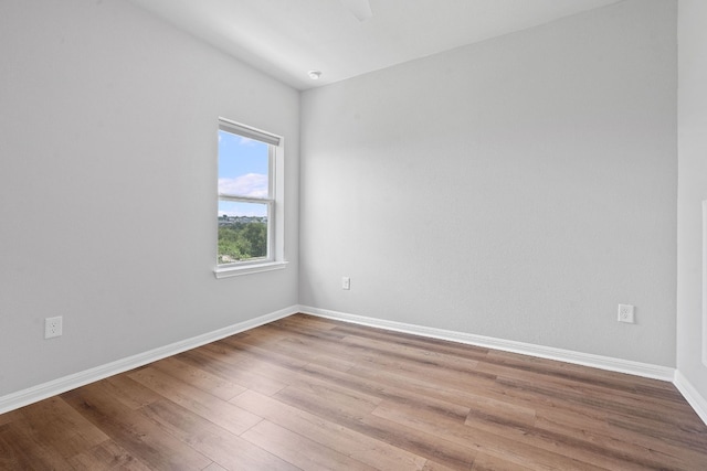 unfurnished room with light hardwood / wood-style floors