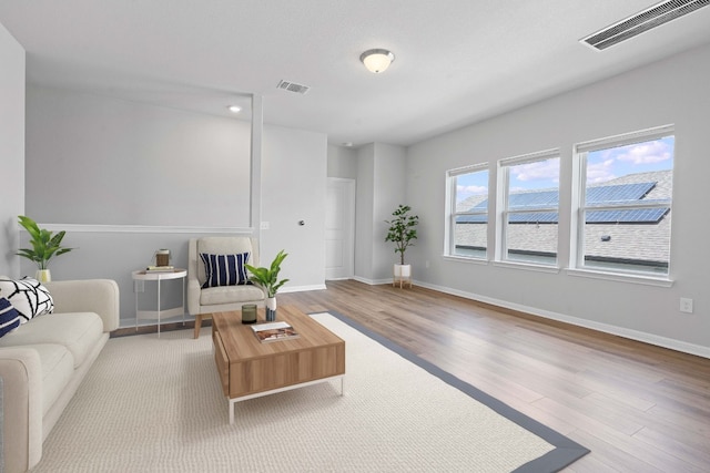 living room with light hardwood / wood-style floors