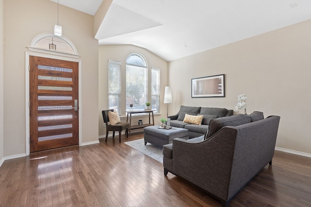 living room featuring dark hardwood / wood-style flooring and lofted ceiling