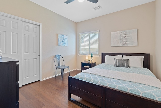 bedroom featuring hardwood / wood-style flooring, ceiling fan, and a closet