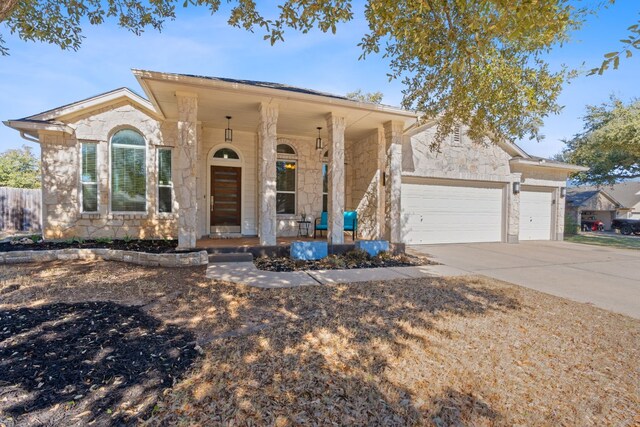 view of front of house with a garage and covered porch