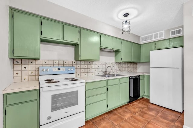 kitchen with pendant lighting, sink, white appliances, and tasteful backsplash