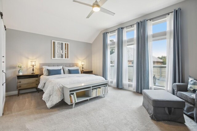 bedroom with carpet floors, ceiling fan, and vaulted ceiling