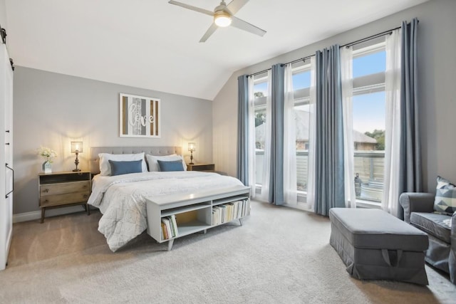 bedroom featuring ceiling fan, vaulted ceiling, and carpet flooring