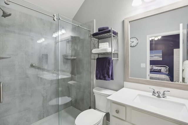 ensuite bathroom with a stall shower, toilet, vanity, and ensuite bath