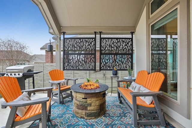 balcony featuring an outdoor fire pit