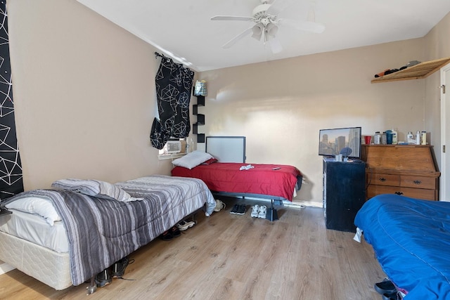 bedroom featuring ceiling fan and light wood-type flooring