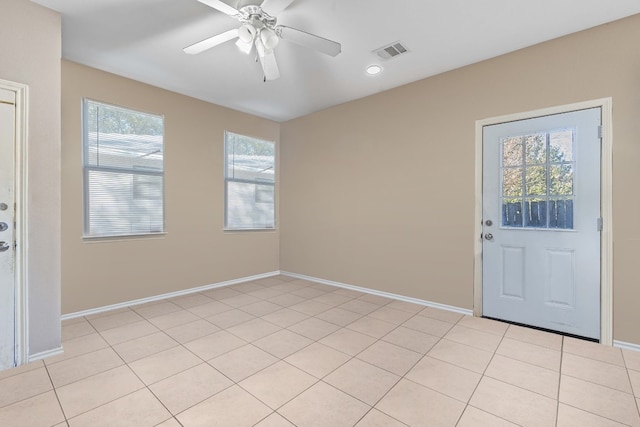 foyer entrance featuring ceiling fan and light tile patterned floors