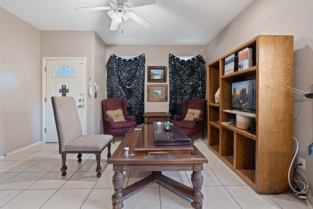 living room with light tile patterned flooring and ceiling fan