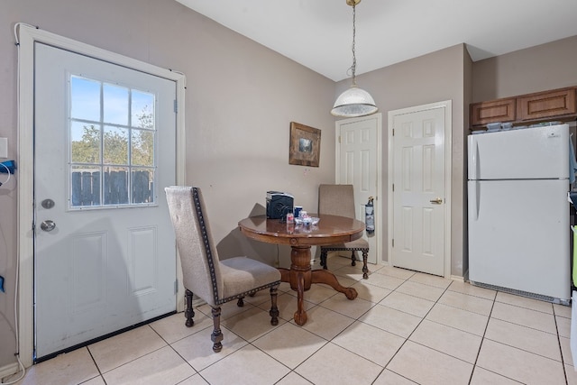 dining area featuring light tile patterned flooring