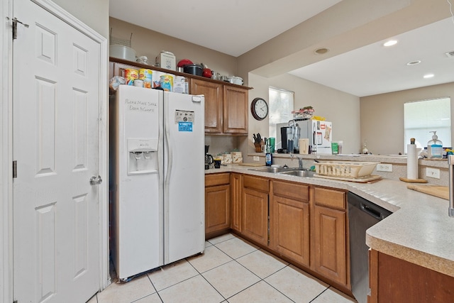 kitchen with light tile patterned flooring, dishwasher, sink, white fridge with ice dispenser, and kitchen peninsula