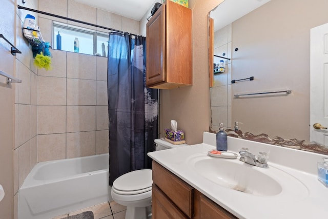 full bathroom featuring vanity, tile patterned floors, shower / bath combo with shower curtain, and toilet