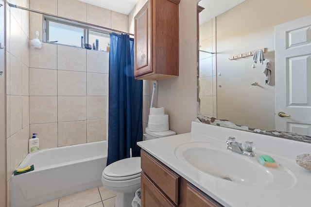 full bathroom featuring tile patterned flooring, vanity, toilet, and shower / tub combo with curtain