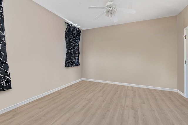 unfurnished room featuring ceiling fan and light hardwood / wood-style flooring