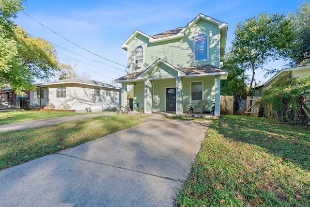 view of front of home featuring a porch and a front lawn