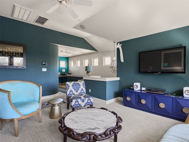 carpeted living room featuring lofted ceiling and ceiling fan