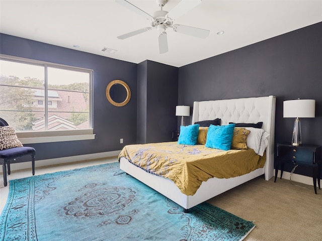 carpeted bedroom featuring ceiling fan