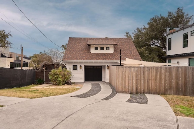 view of front of house with a garage and a front lawn