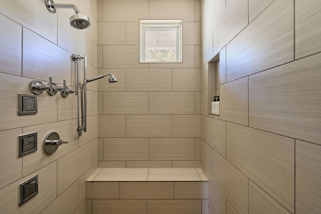 bathroom featuring tiled shower