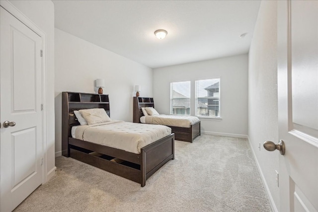 bedroom featuring light colored carpet