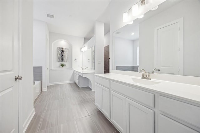 bathroom with vanity and tile patterned flooring