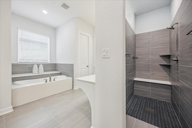 bathroom featuring tile patterned floors and plus walk in shower