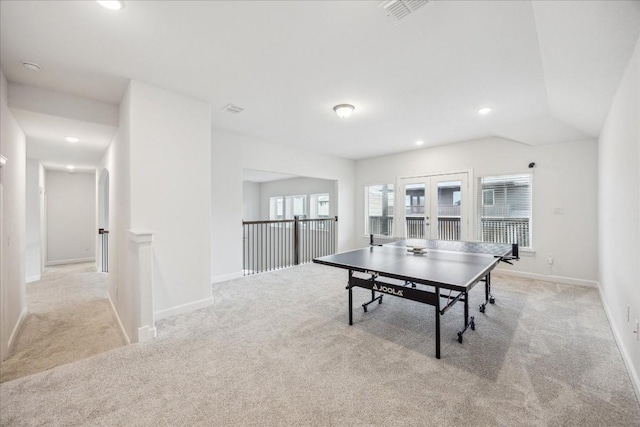 recreation room with french doors and light carpet