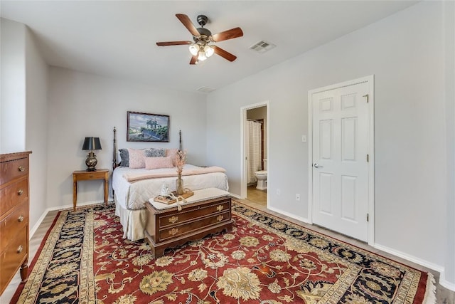 bedroom featuring ceiling fan and ensuite bathroom