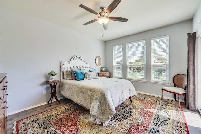 bedroom featuring hardwood / wood-style floors and ceiling fan