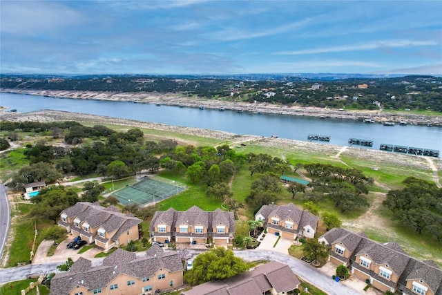 birds eye view of property featuring a water view