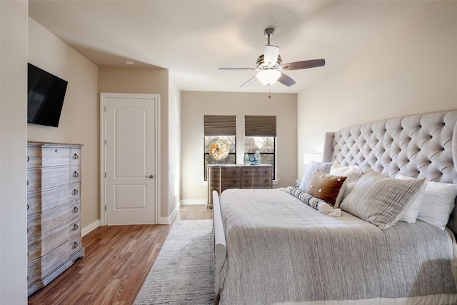 bedroom featuring hardwood / wood-style flooring and ceiling fan