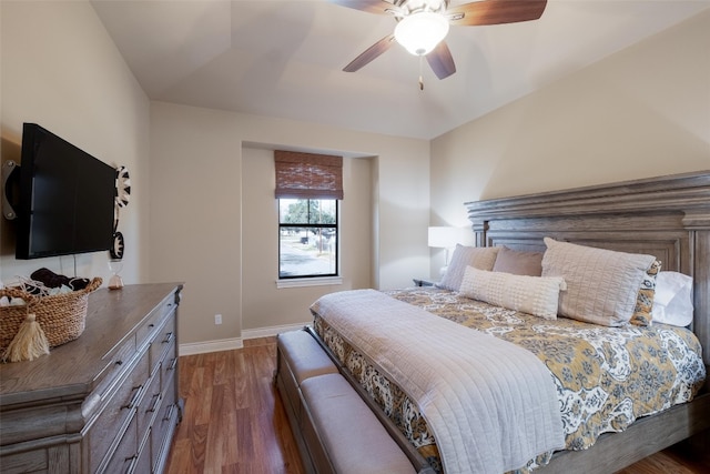 bedroom featuring ceiling fan and dark hardwood / wood-style floors